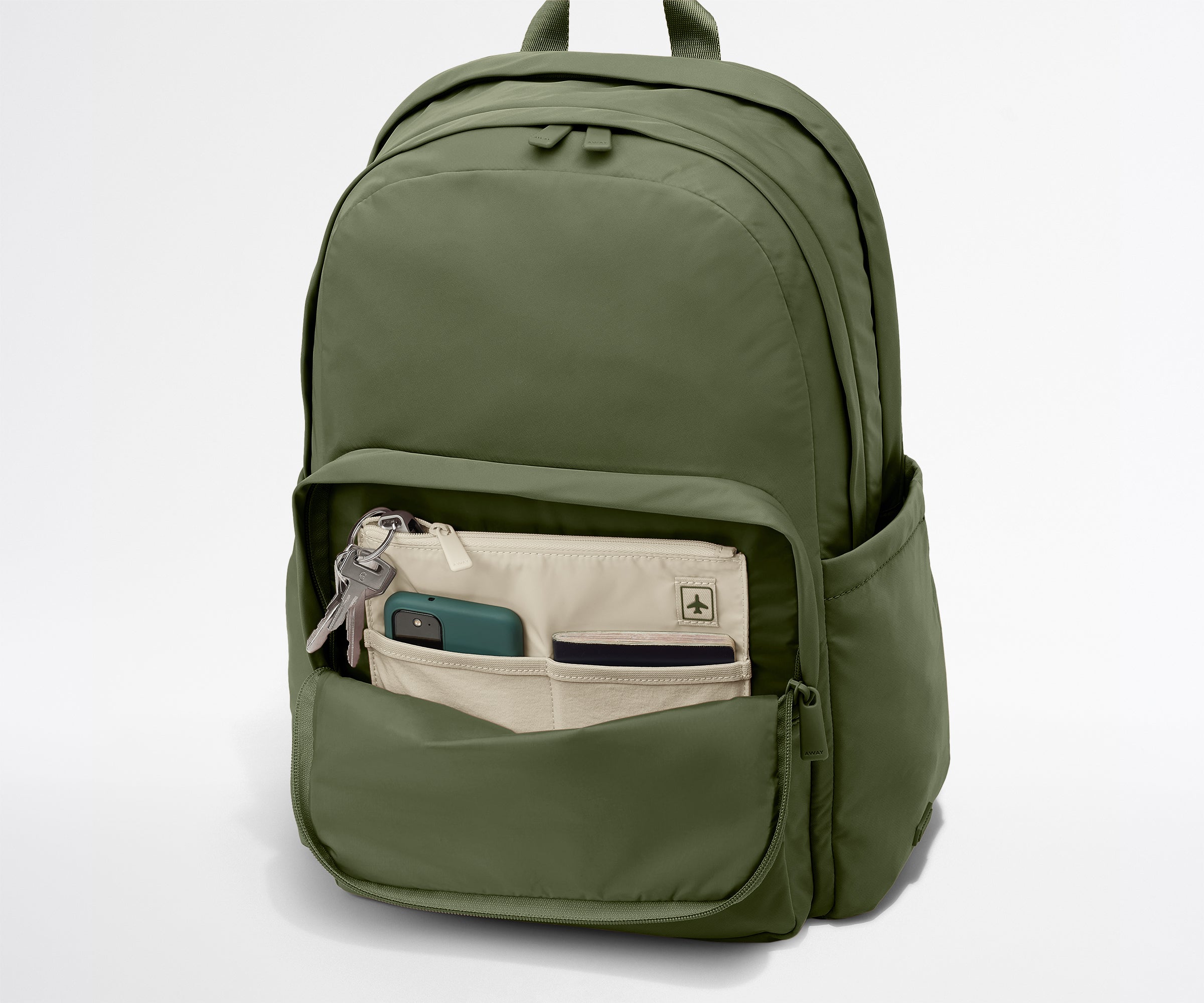 Green backpack with front pocket on a white background