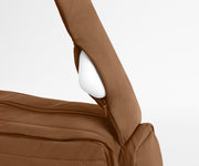 Earpods packed in the discreet, zippered strap pocket