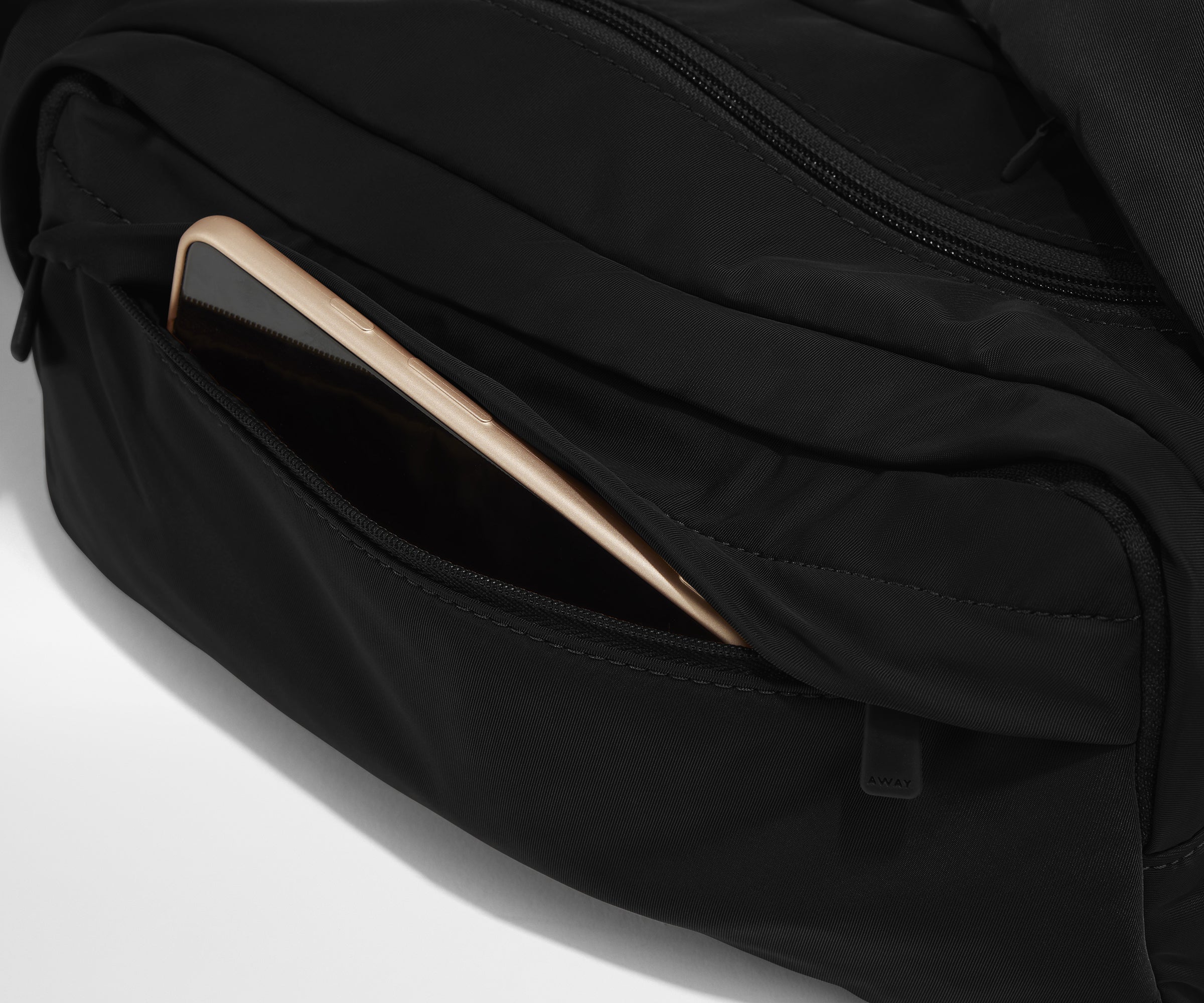 Phone packed in the front zip pocket