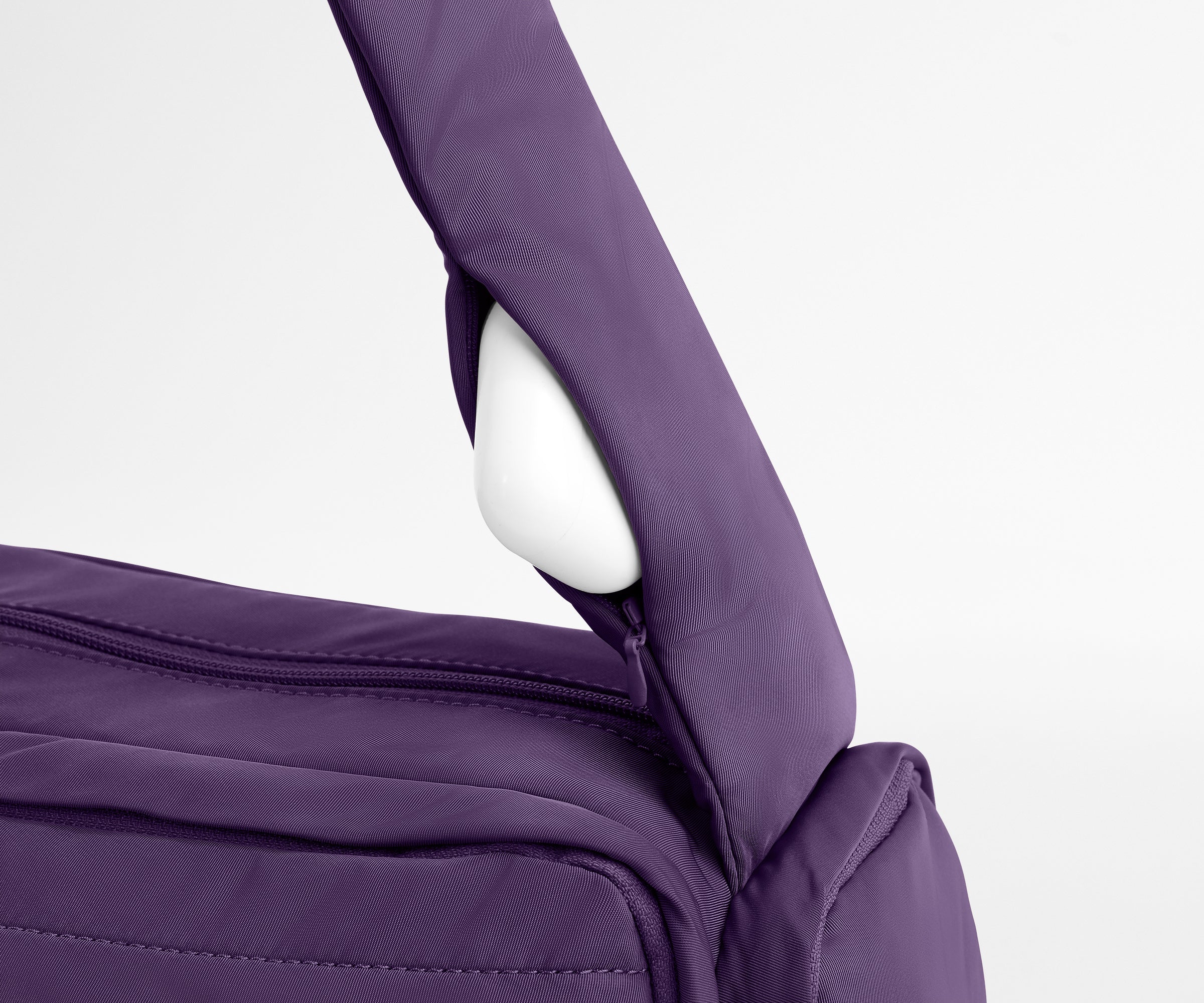 Earpods packed in the discreet, zippered strap pocket