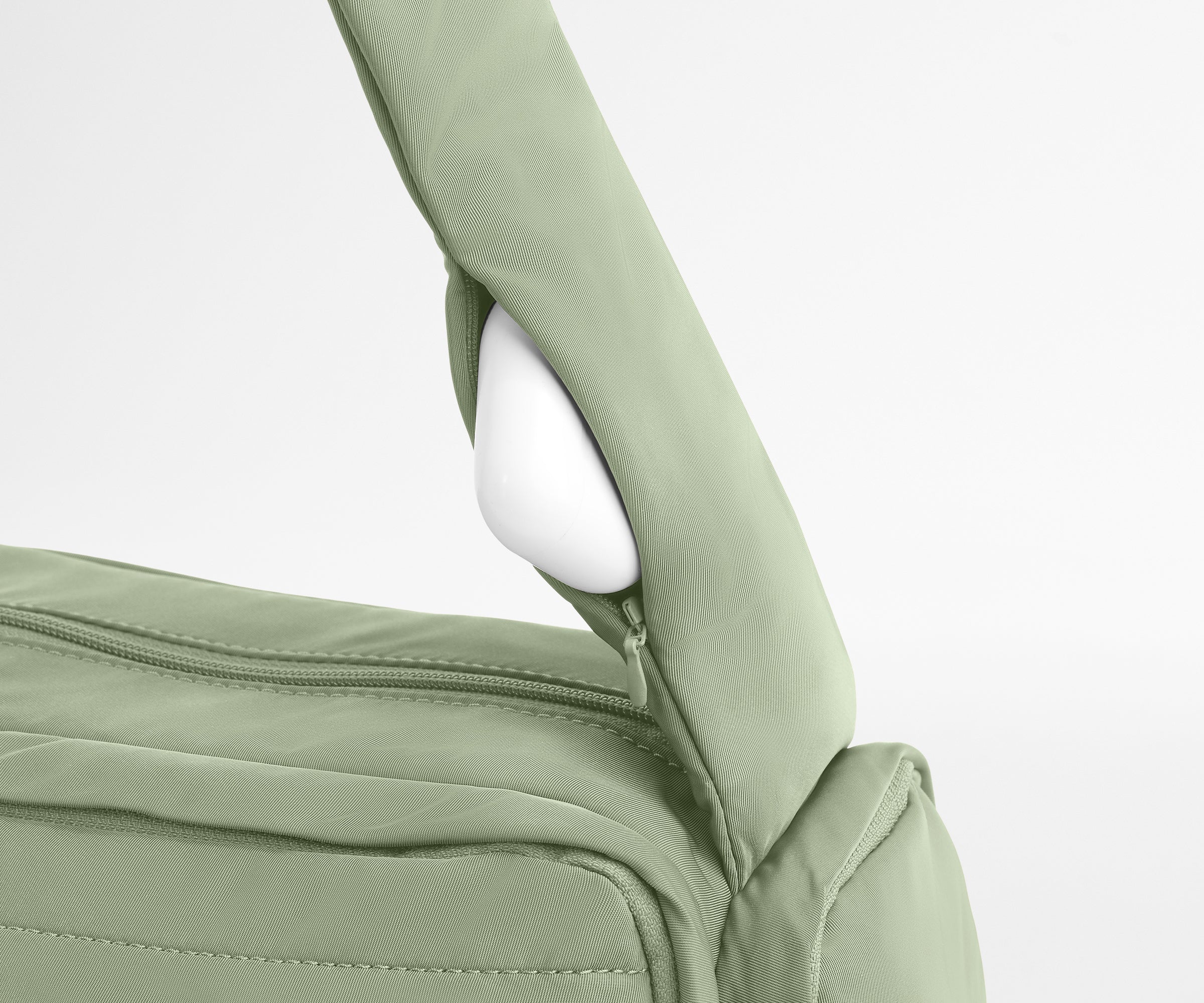 Earpods packed in the discreet, zippered strap pocket