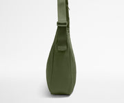 Green shoulder bag on a white background