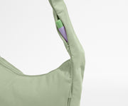 Chapstick in the discreet, zippered strap pocket