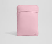 Pink laptop sleeve on a light gray background