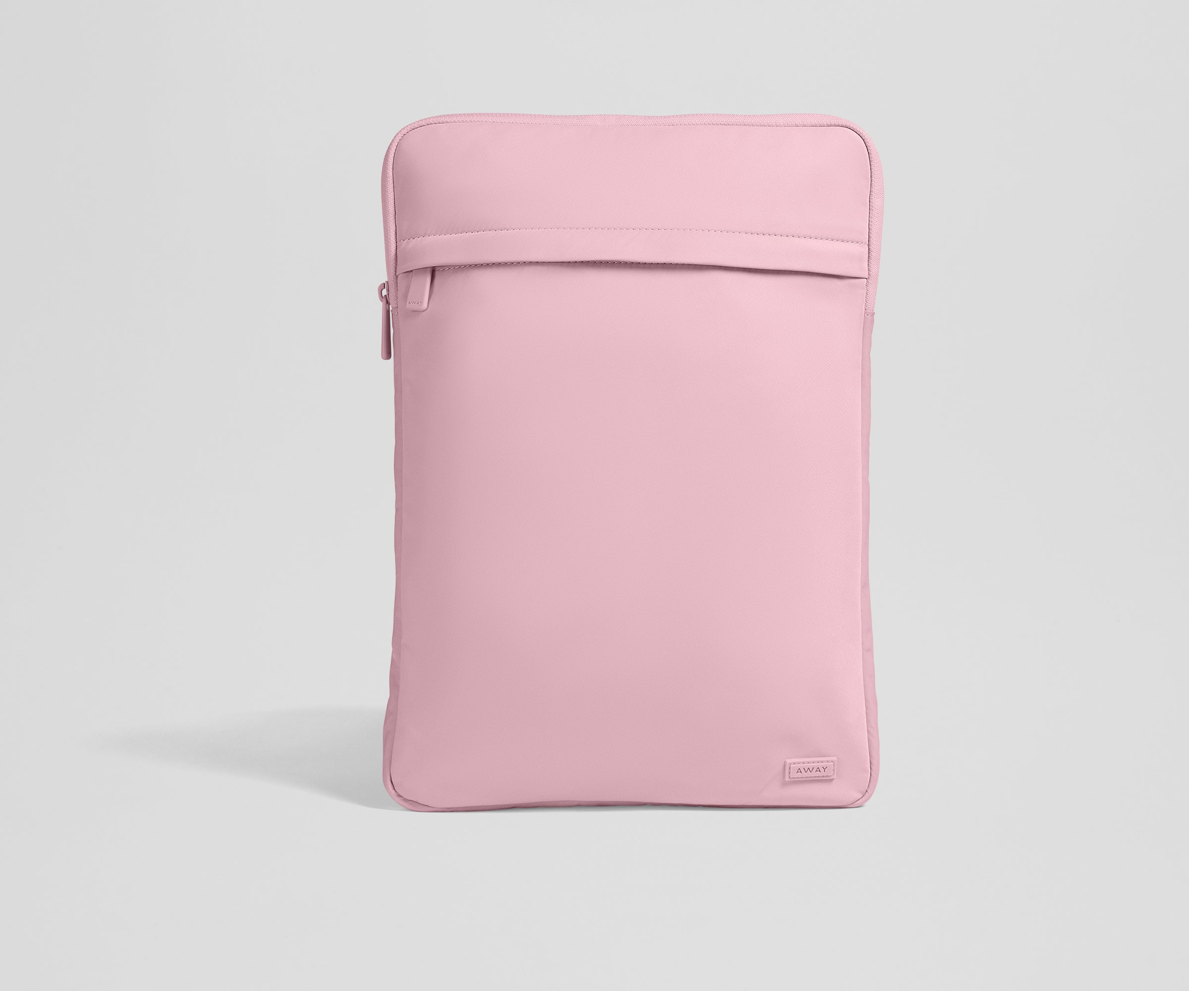 Pink laptop sleeve on a light gray background