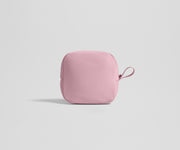 Pink tech pouch on a light gray background
