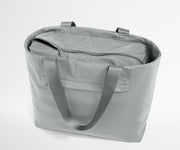Gray tote bag with a shoulder strap on a light gray background