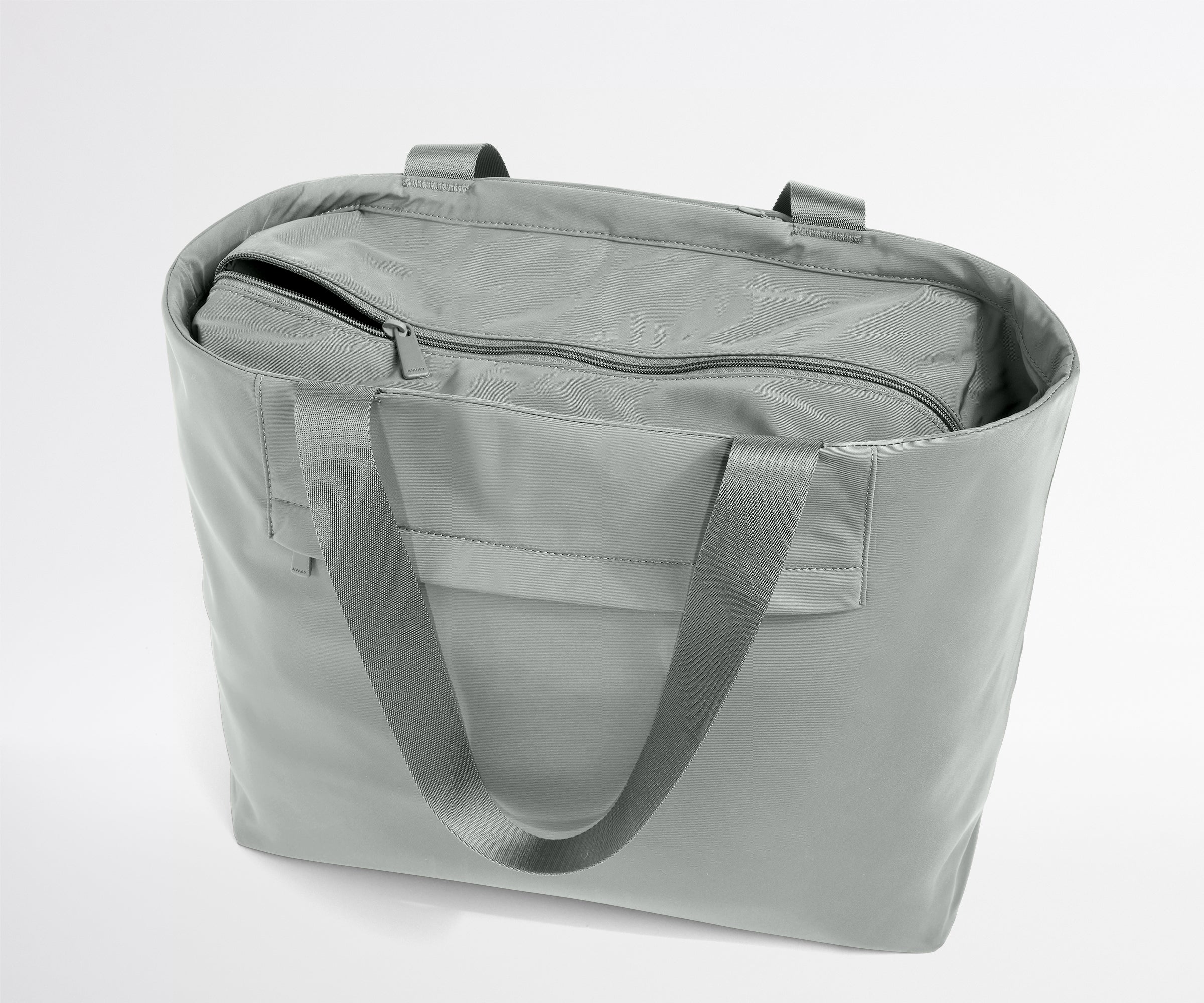 Gray tote bag with a shoulder strap on a light gray background
