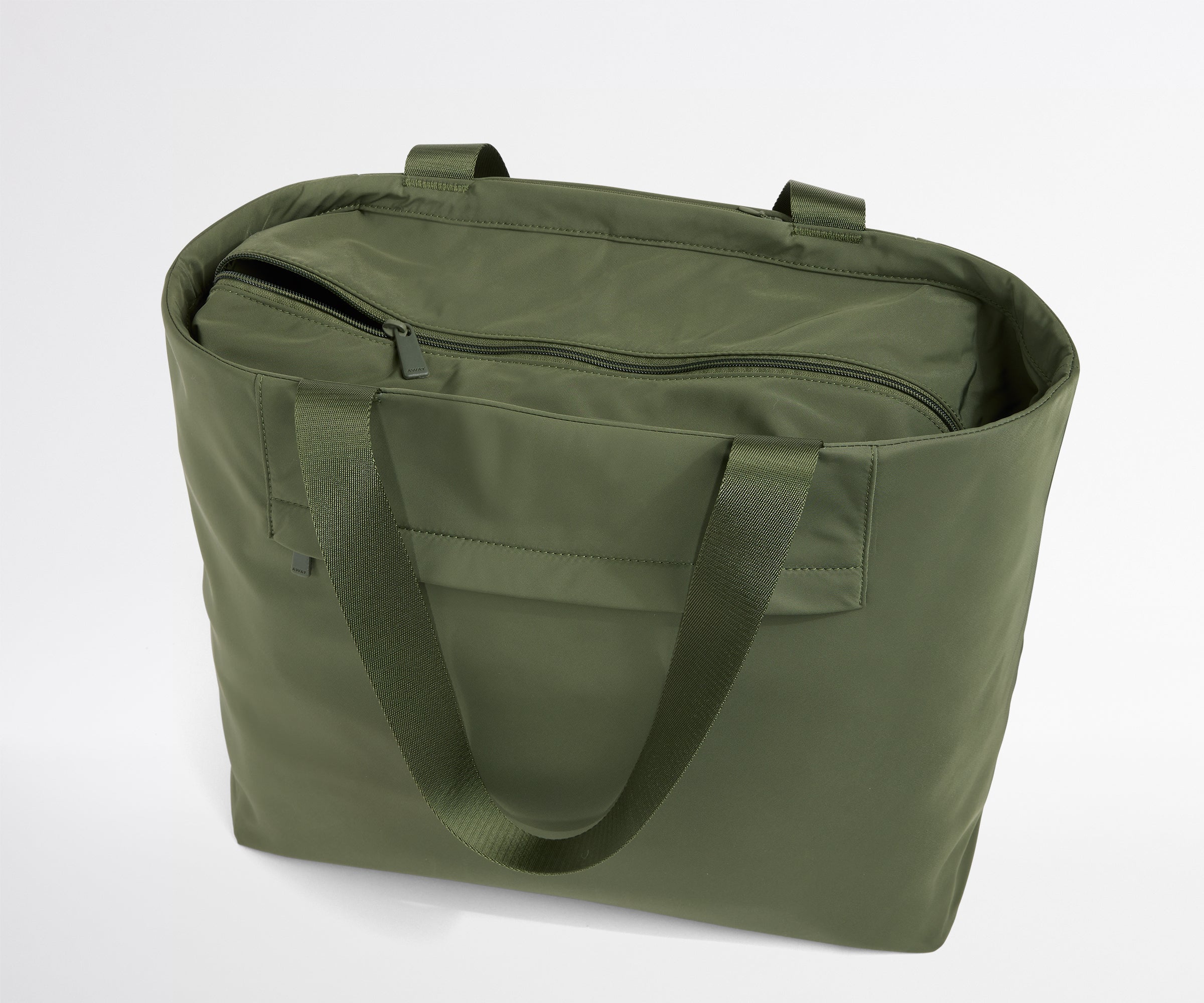 Green tote bag with handles on a white background