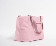 Pink tote bag on a light gray background