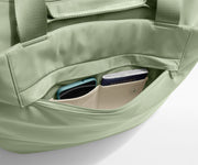 Phone and passport packed in an exterior zip pocket