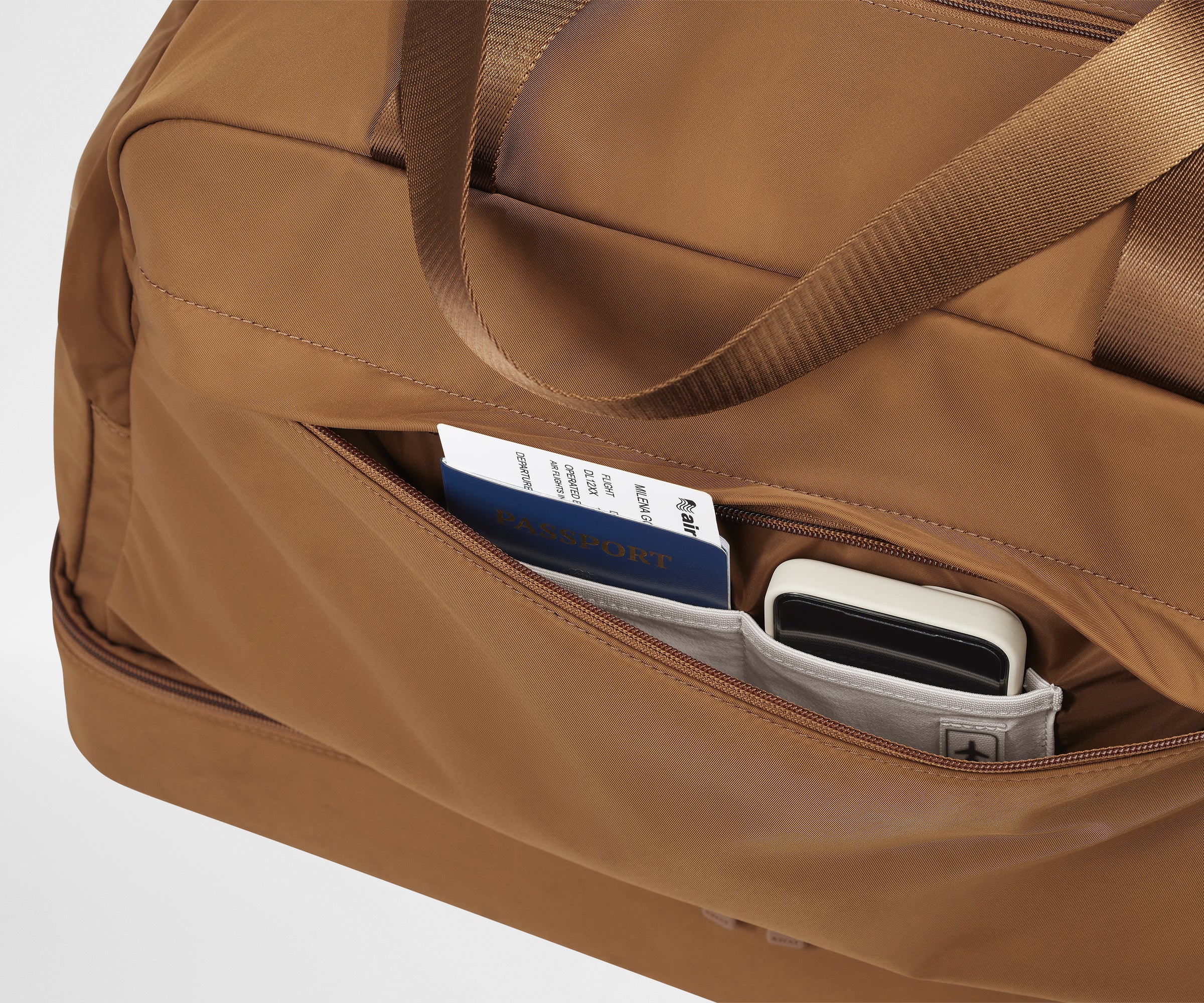 Front zipper pocket with phone and passport in their dedicated travel pockets