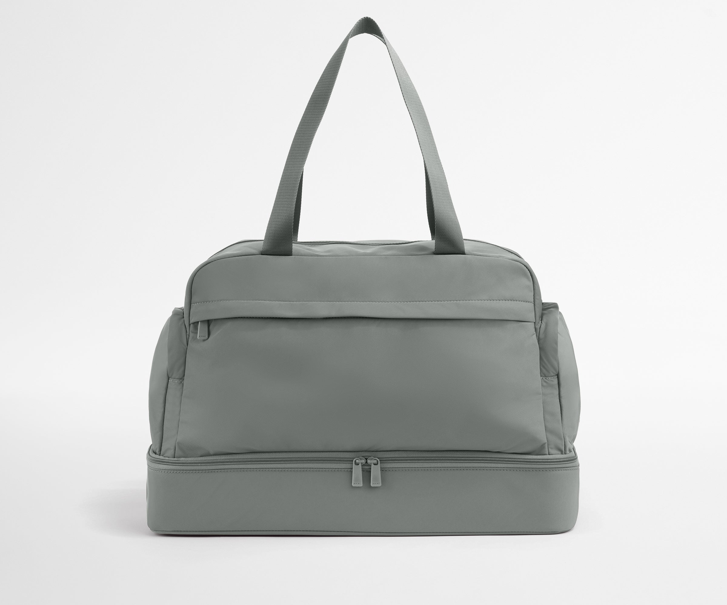 Gray duffel bag on a light gray background