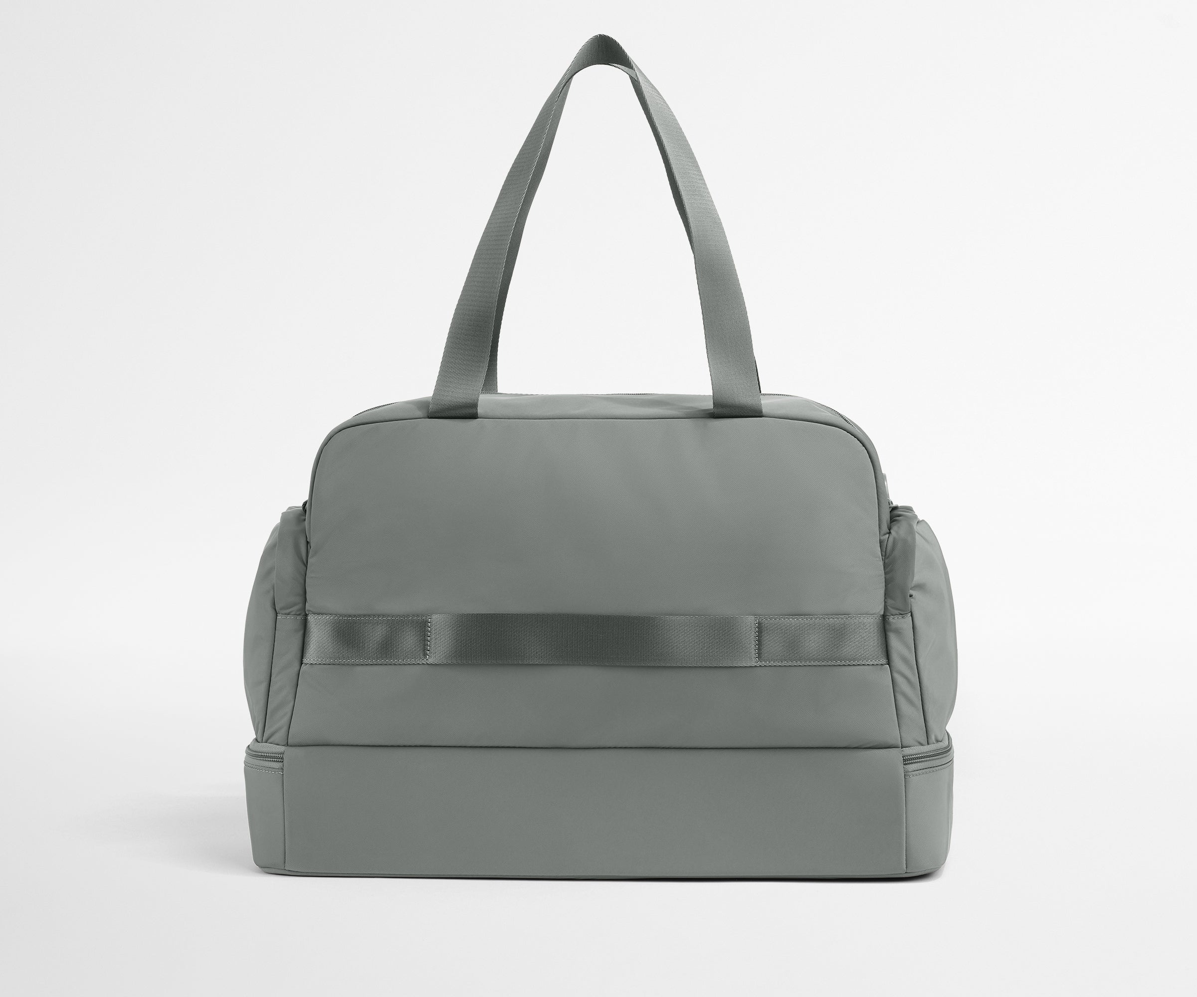 Gray duffel bag on a light gray background