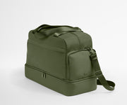 Green duffel bag with a shoulder strap on a light gray background