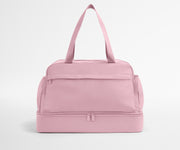 Pink duffel bag on a light gray background