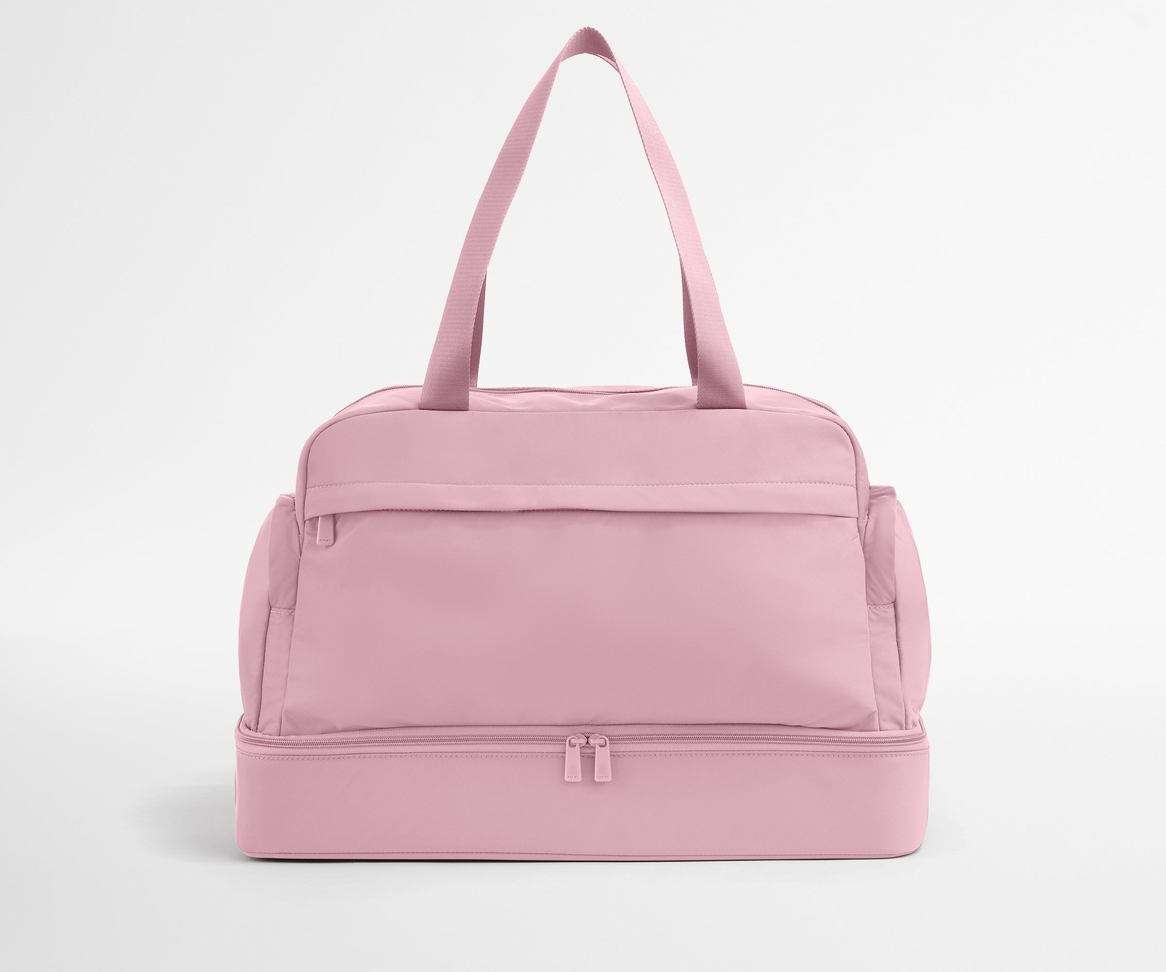 Pink duffel bag on a light gray background