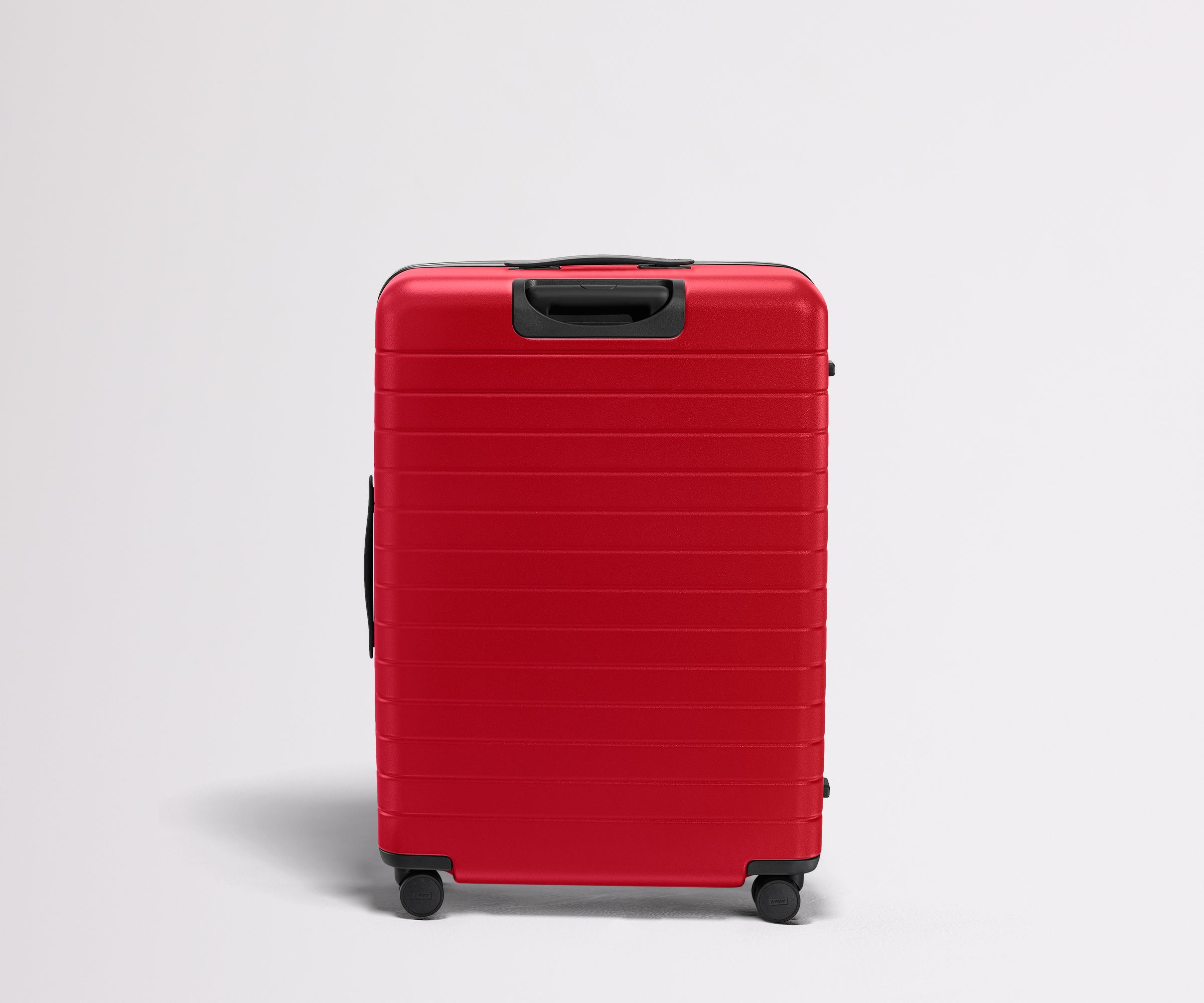 Red suitcase on a light gray background