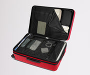 Red suitcase with black interior compartments on a light gray background