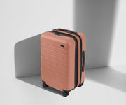 Angled product view of The Carry-On Flex suitcase in Clay Pink
