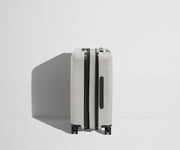 Side product view of The Carry-On Flex suitcase in Cloud Gray shown fully expanded