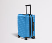 Angled product view of The Bigger Carry-On Flex suitcase in Splash Blue