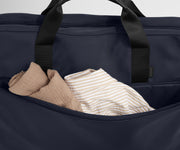 Close up of the front pocket of the Garment Bag in Navy Blue to show more space to pack extra clothes