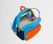 Top down product view of the packed Kids Backpack in Splash Blue, showing how it fits clothes, tablet, notebook and headphones.