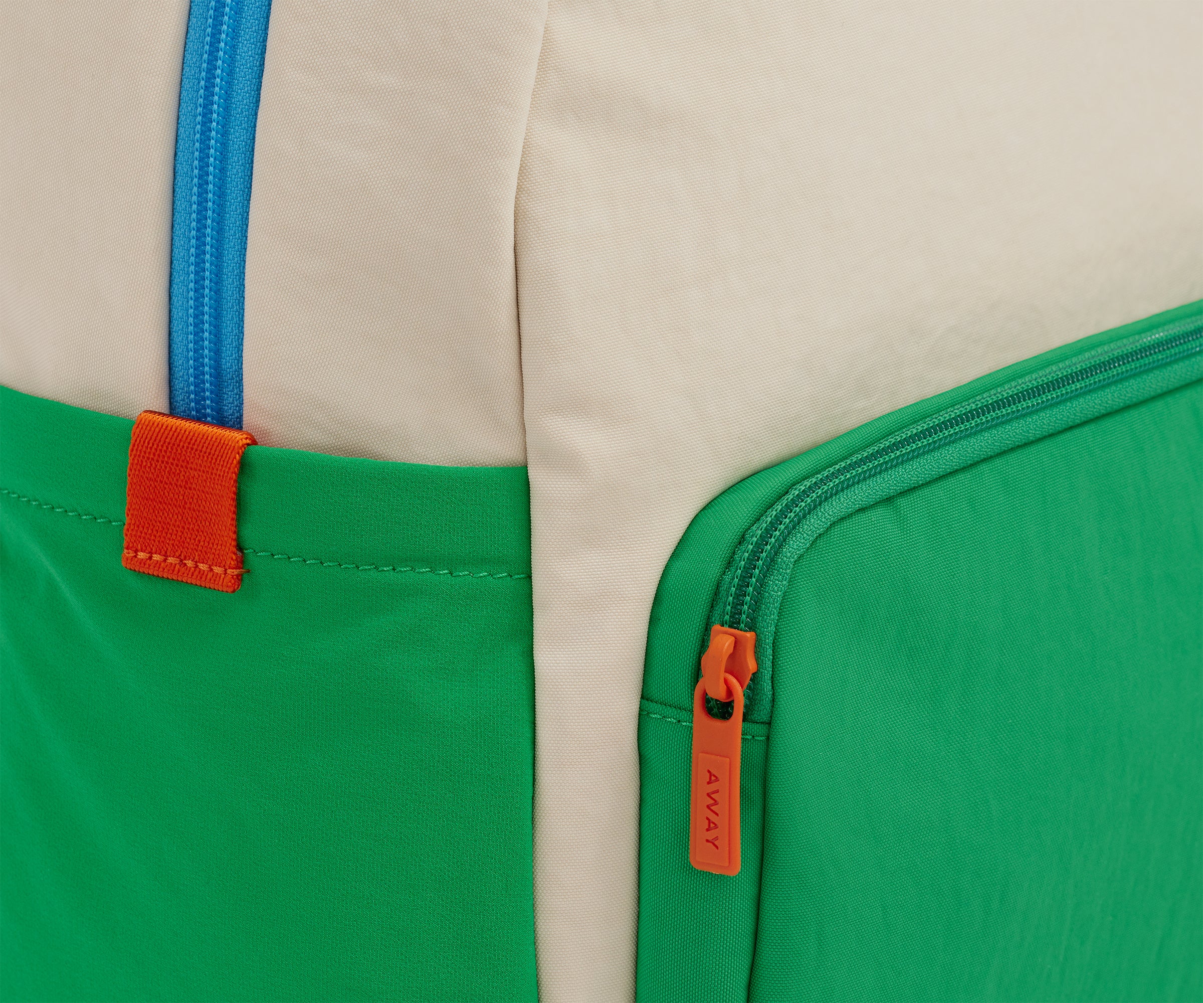 A close up shot of the Kids Backpack in Marshmallow White to show the colorblocked details and machine-washable material