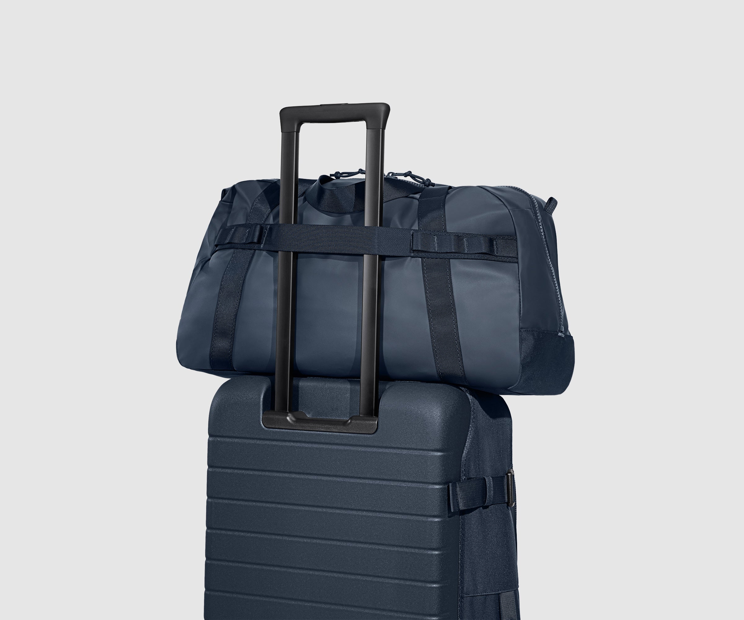 Back view of the Active Duffle 40L sitting on top of the Active Rolling Duffle 85L