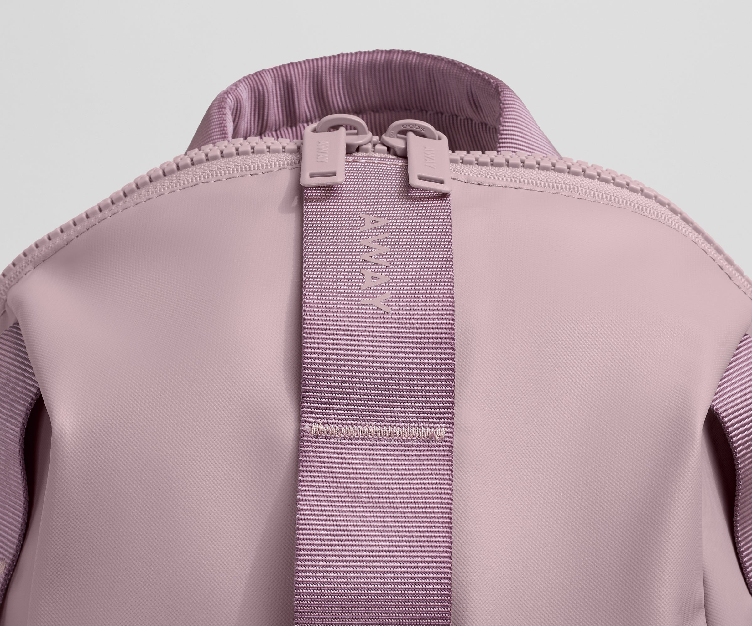 Close up view of the material and Away logo