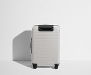 Back product view of The Bigger Carry-On Flex suitcase in Cloud Gray