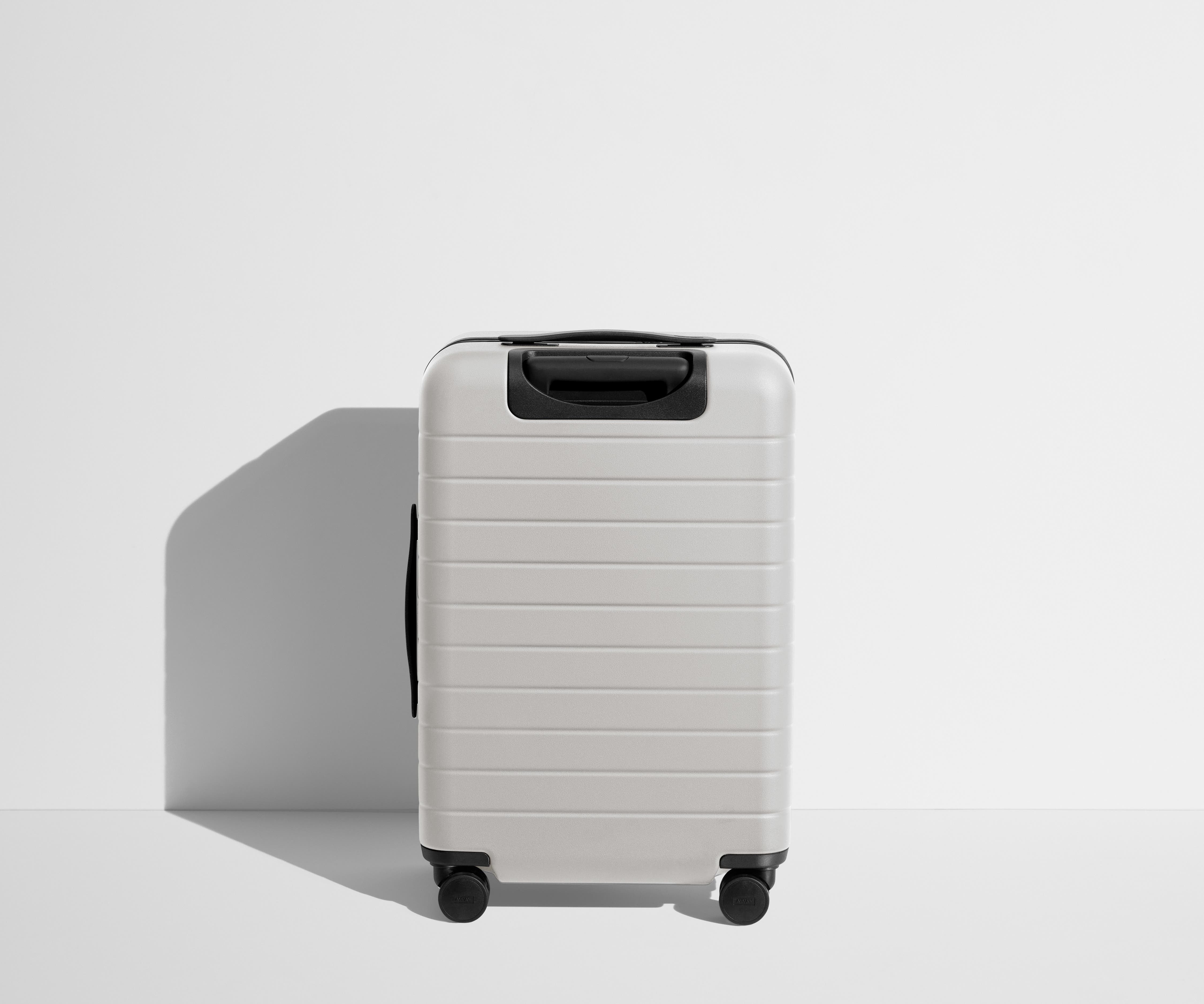 Back product view of The Bigger Carry-On Flex suitcase in Cloud Gray