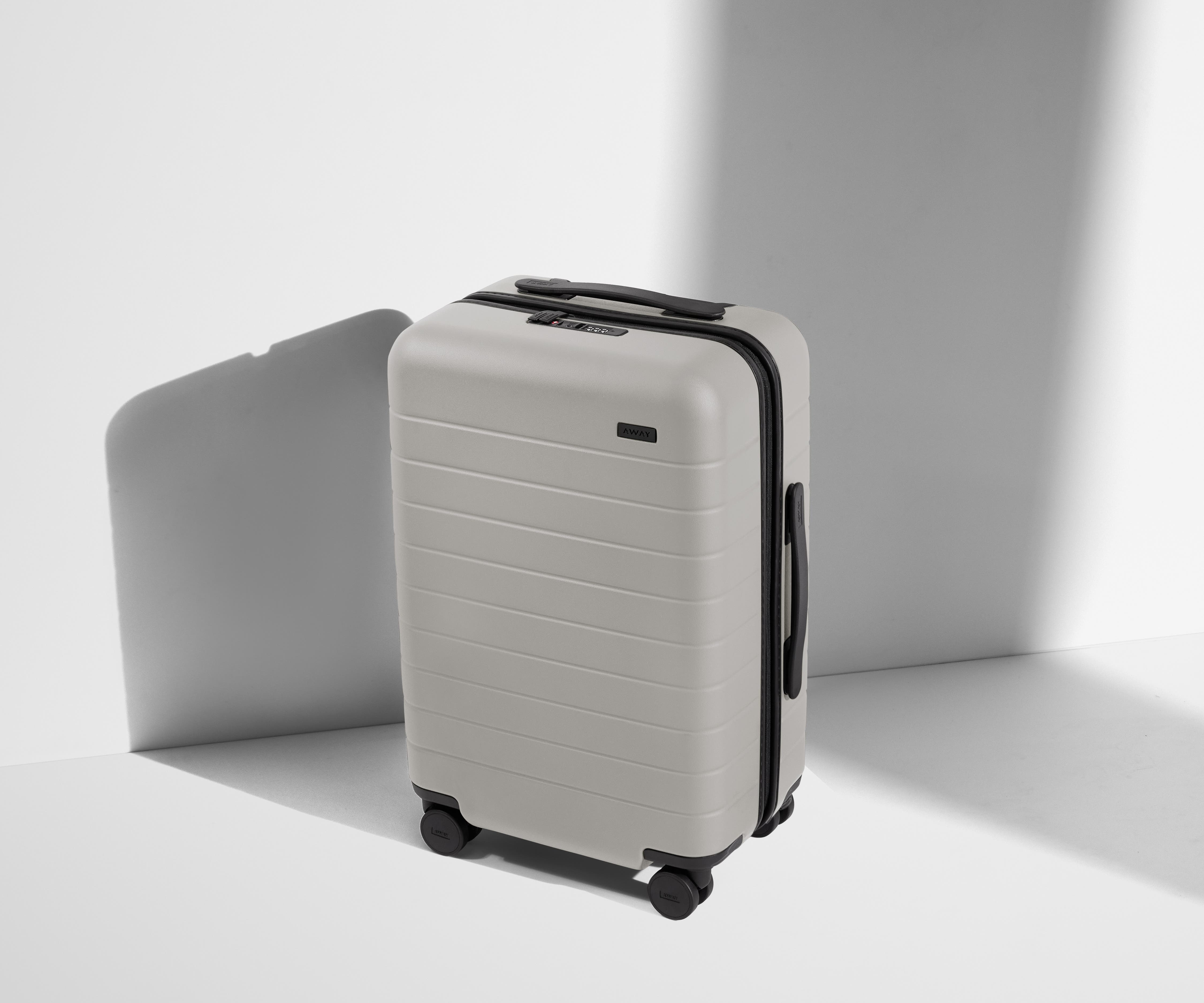 Angled product view of The Carry-On suitcase in Cloud Gray