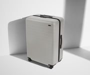 Angled product view of The Large suitcase in Cloud Gray