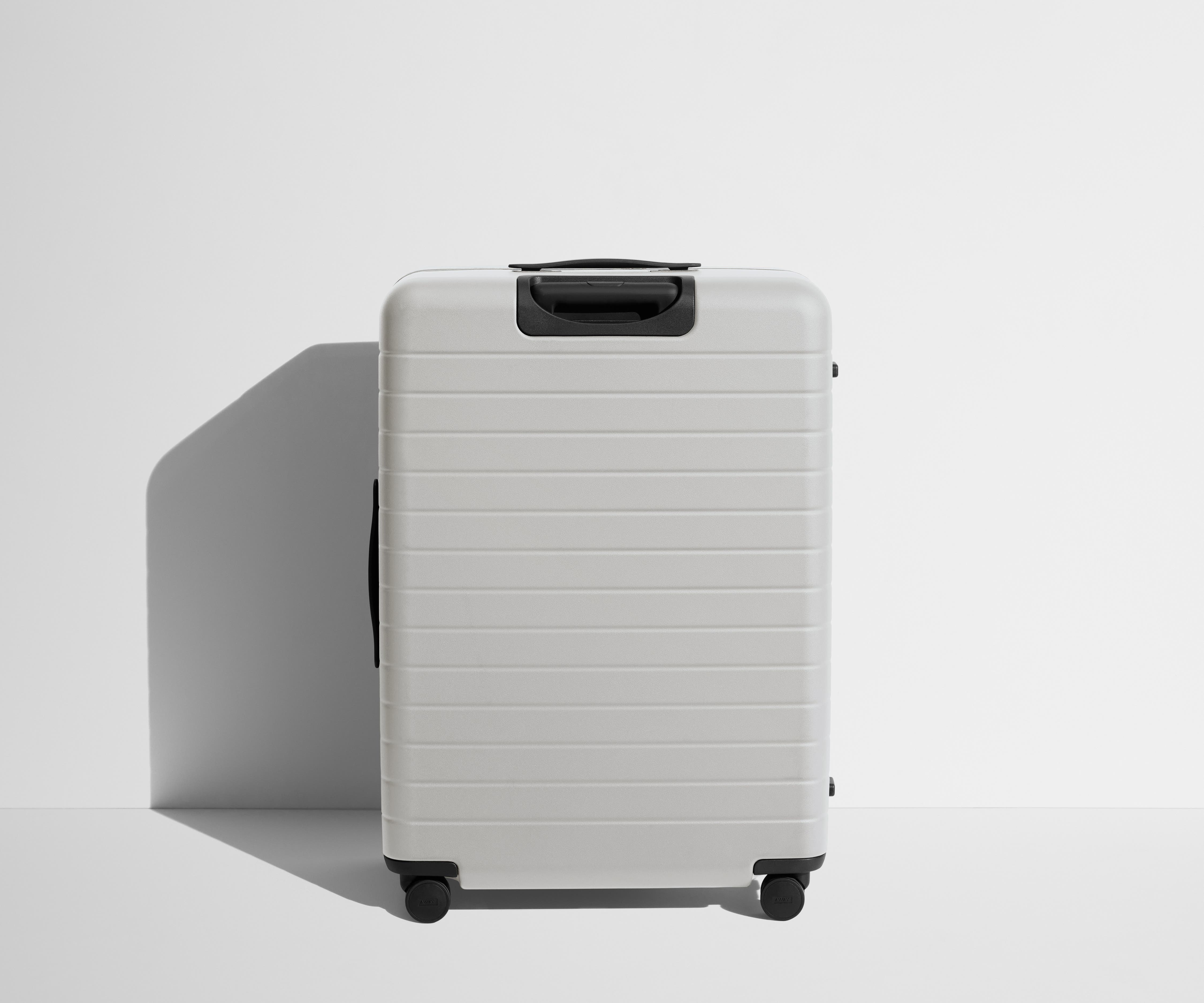 Back product view of The Large Flex suitcase in Cloud Gray