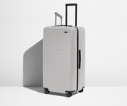 Angled product view of The Trunk suitcase in Cloud Gray