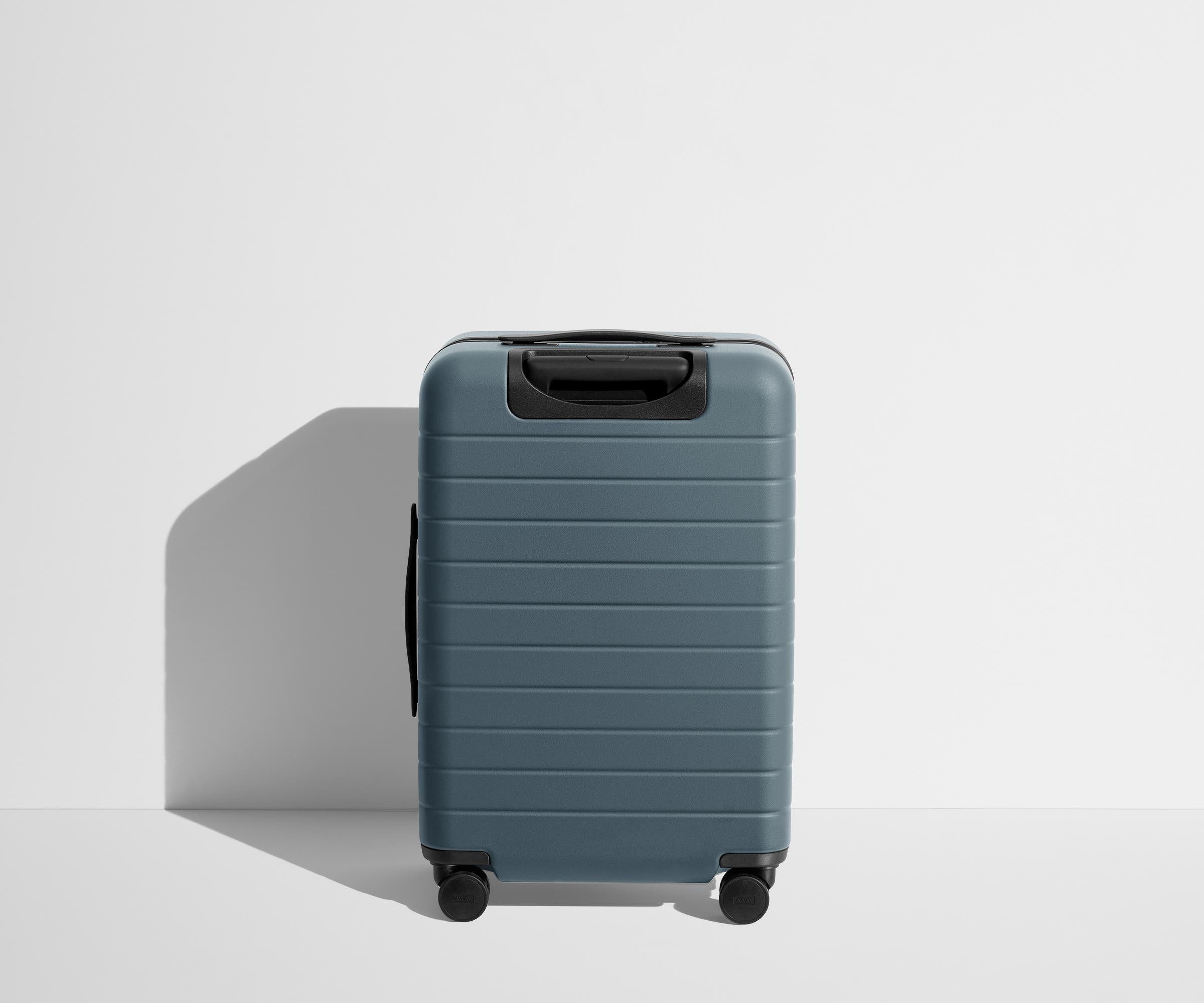 Back product view of The Bigger Carry-On Flex suitcase in Coast Blue