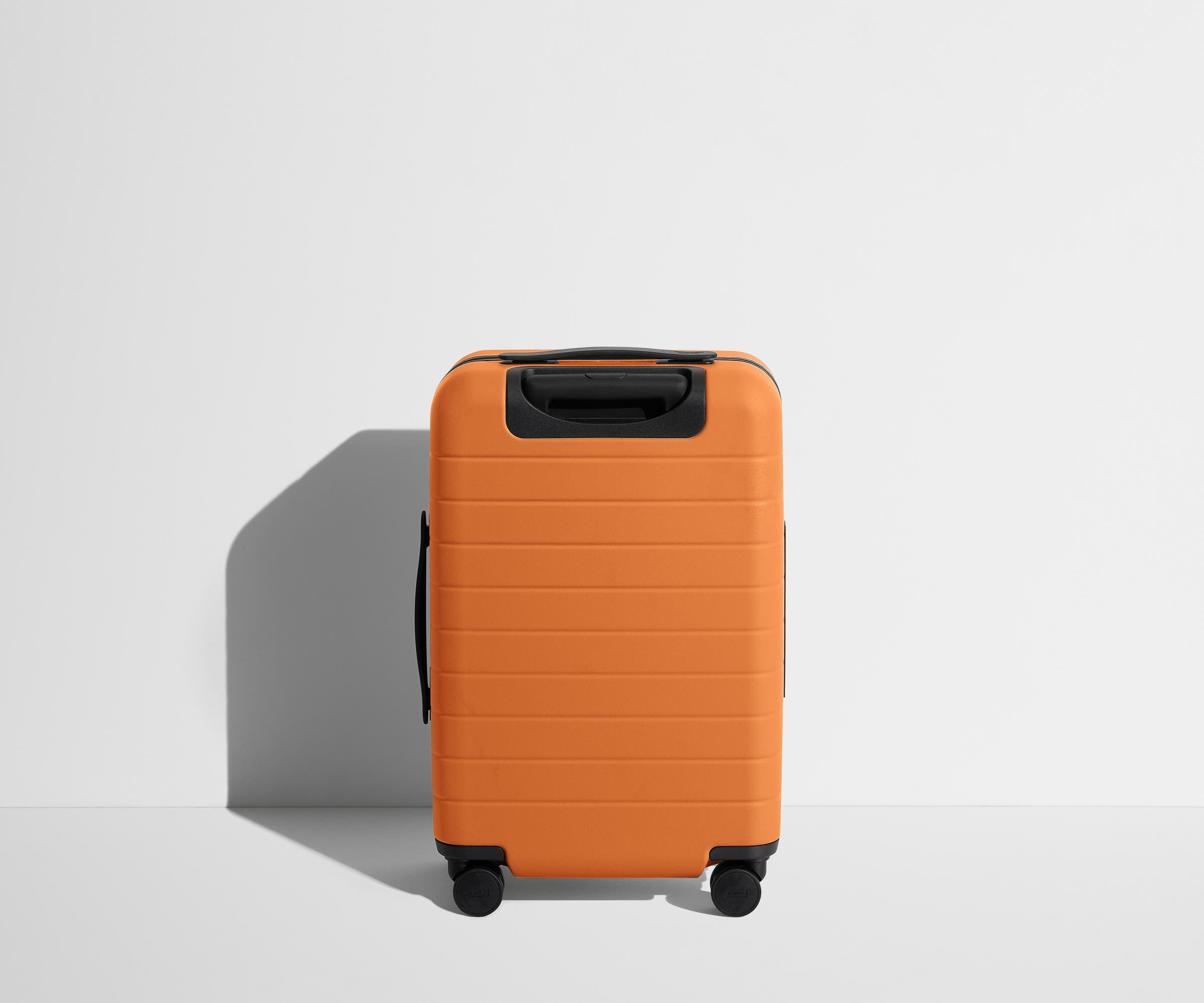 Back product view of The Carry-On Flex suitcase in Sorbet Orange