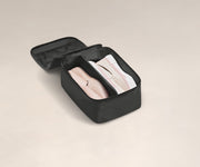 Two pairs of shoes in a small Shoe Cube