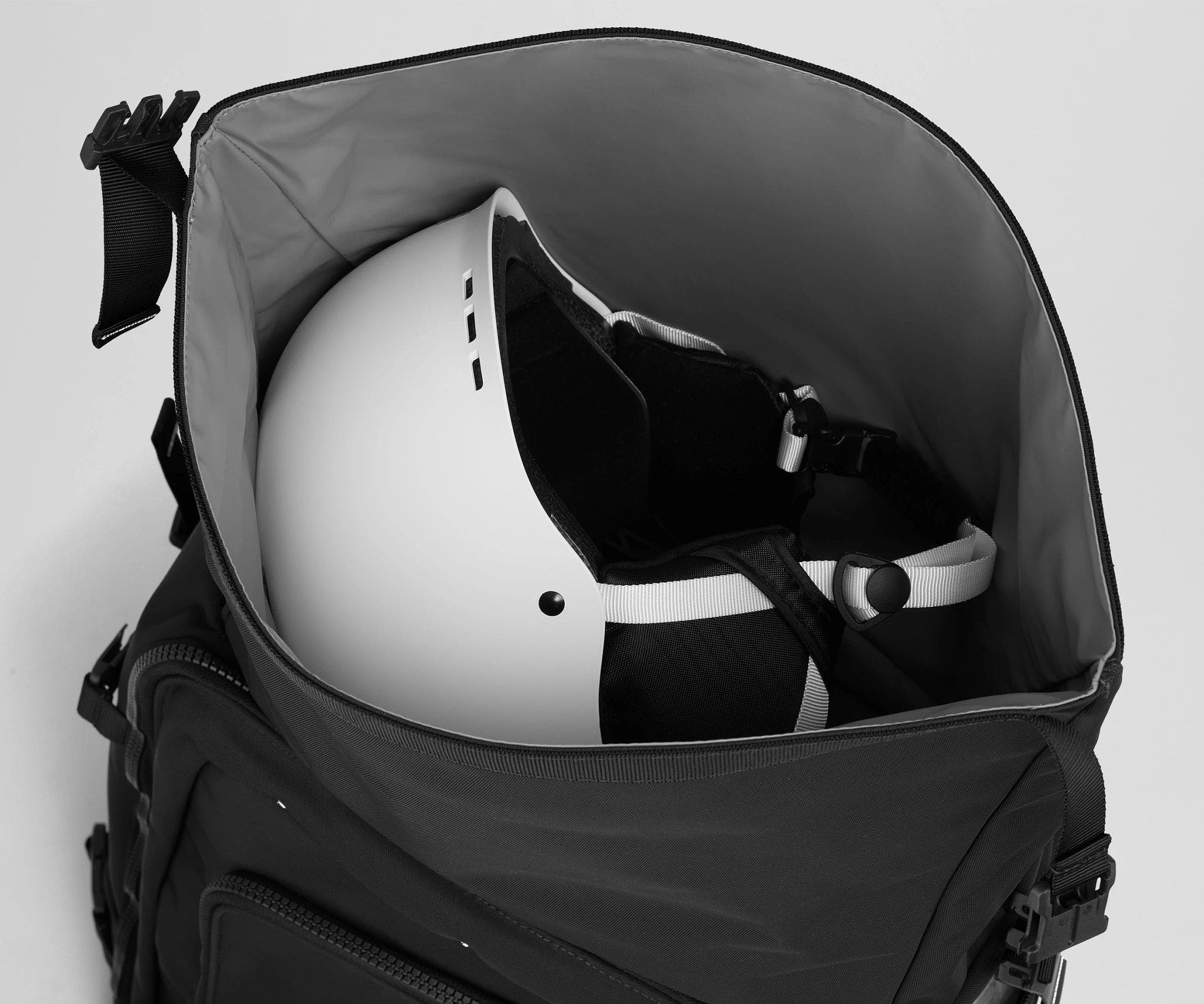 Helmet packed inside the roll-top helmet compartment