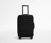 Front product view of The Softside Carry-On suitcase in Jet Black with raised handle