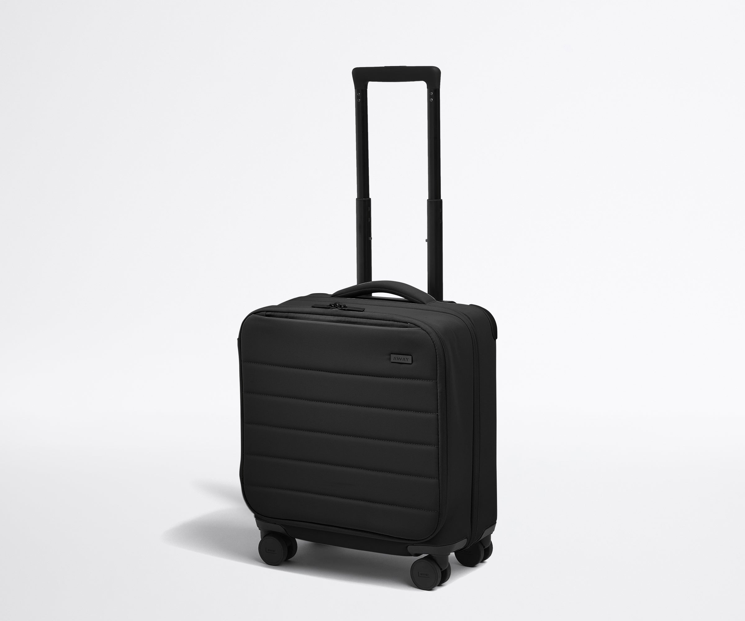 Angled product view of The Softside Compact Carry-On suitcase in Jet Black with raised handle