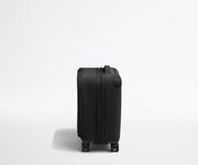 Side product view of The Softside Compast Carry-On suitcase in Jet Black shown fully expanded