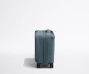 Side product view of The Softside Compast Carry-On suitcase in Coast Blue shown fully expanded