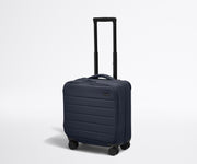 Angled product view of The Softside Compact Carry-On suitcase in Navy Blue with raised handle