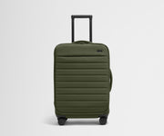 Front product view of The Softside Bigger Carry-On suitcase in Olive Green with raised handle
