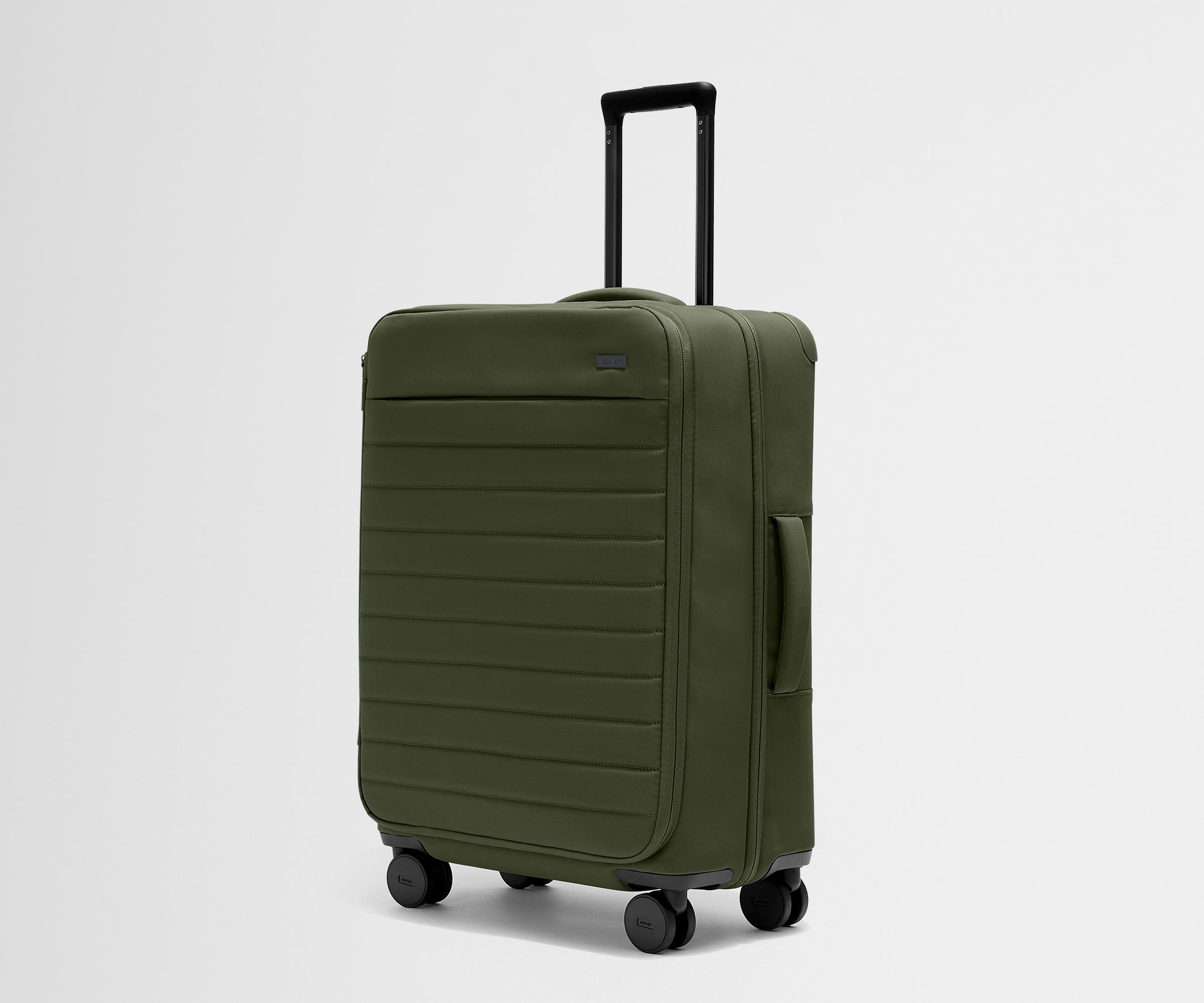 Angled product view of The Softside Medium suitcase in Olive Green with raised handle