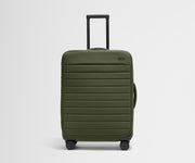 Front product view of The Softside Medium suitcase in Olive Green with raised handle
