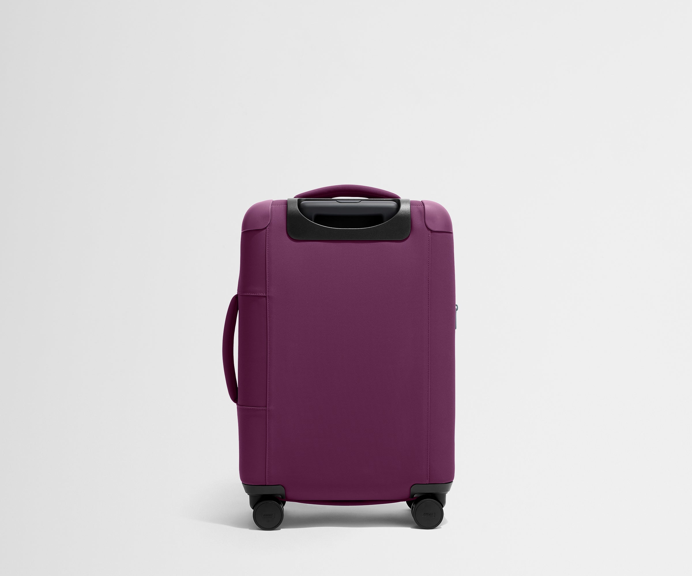 Back product view of The Softside Carry-On suitcase in Plum Purple